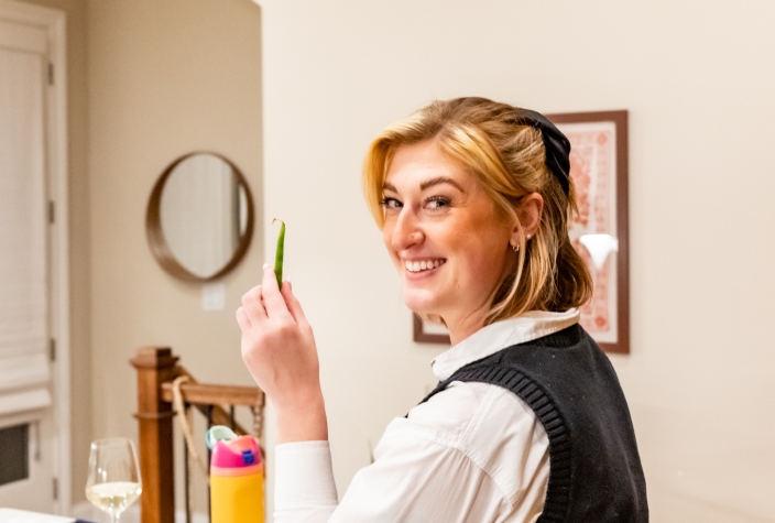 Girl preparing green beans for a meal