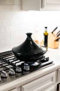 A tagine sitting on a kitchen stove