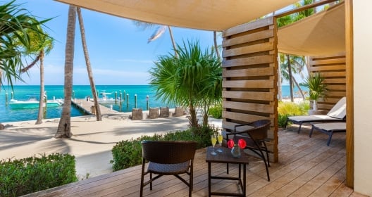 oceanfront with dock and lounge areas