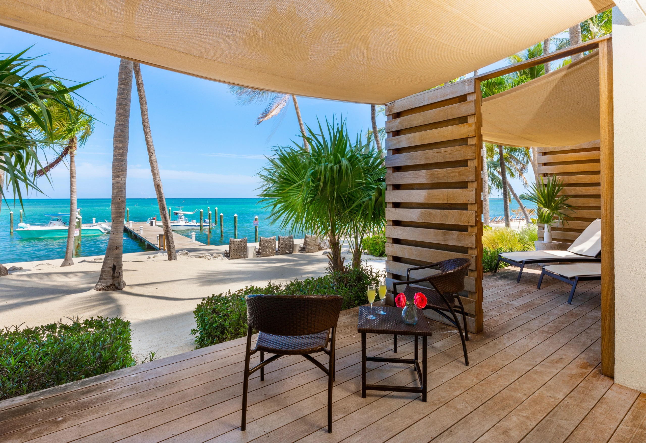 oceanfront with dock and lounge areas