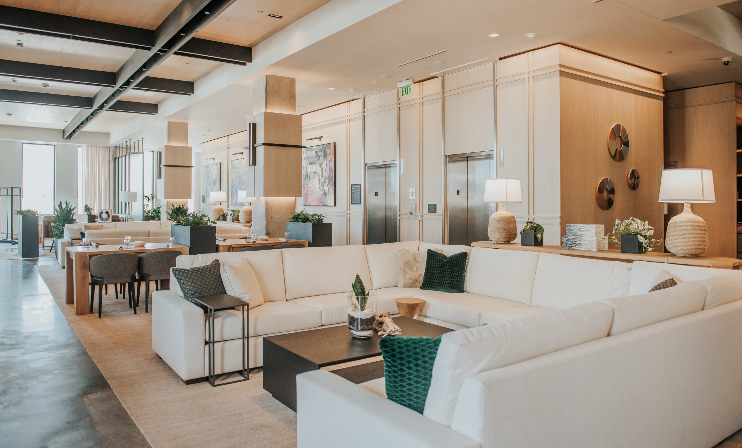 The lobby of the Bellyard hotel with large white leather couches