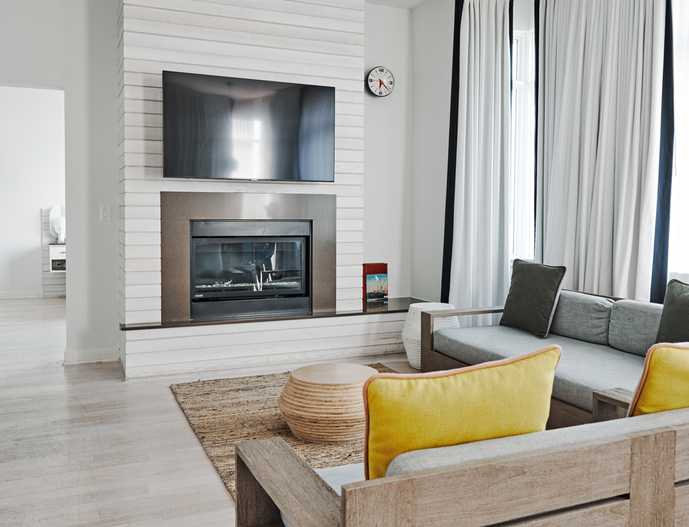 living area with tv over fireplace