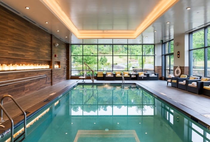 interior image of a hotel pool with a fireplace