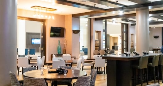 The restaurant at the Little Rock Marriott filled with tables and high-top seating