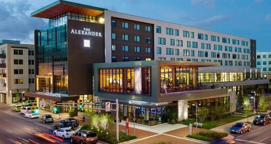 The exterior of The Alexander hotel as seen as dusk
