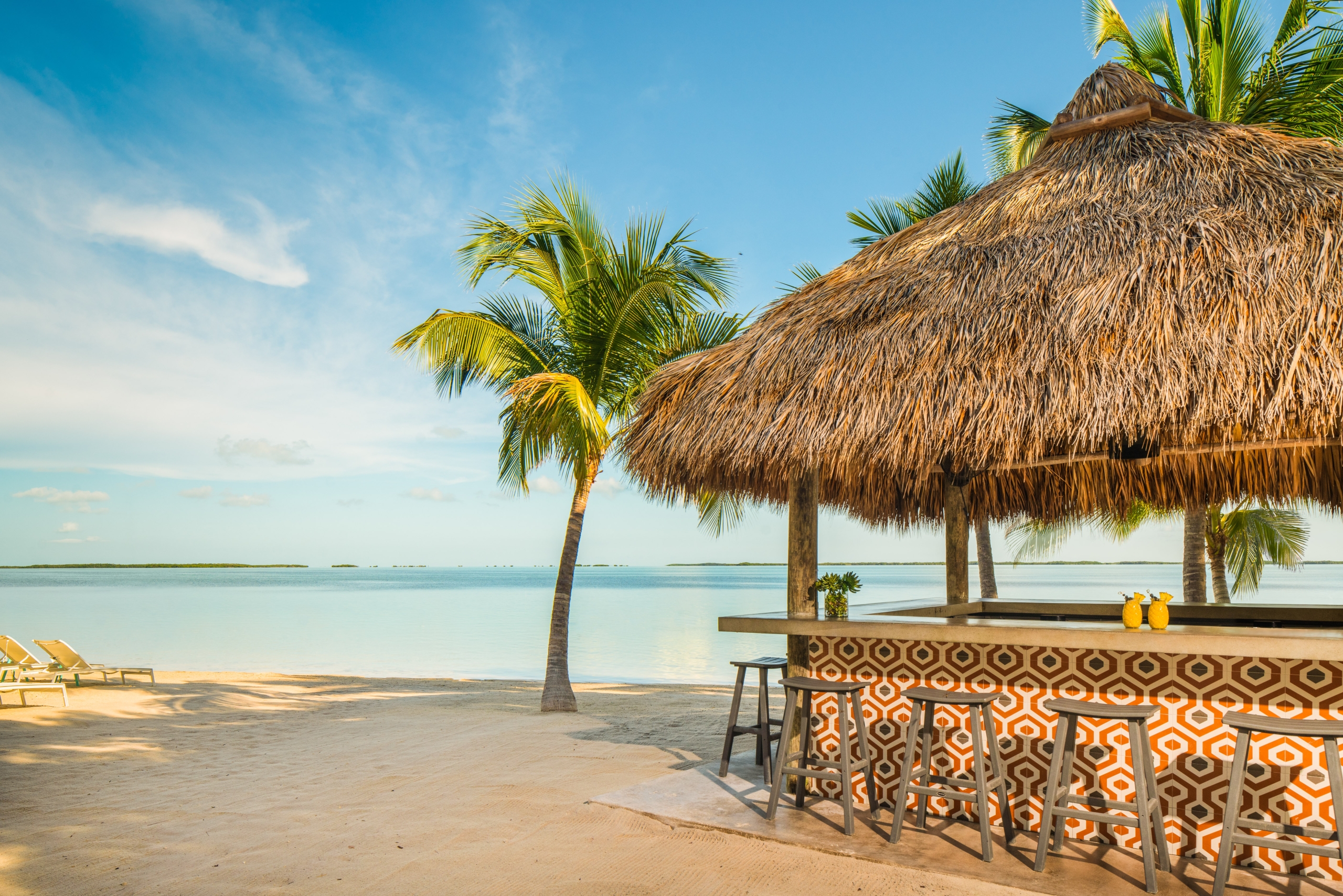 An outdoor tiki hut on the beach