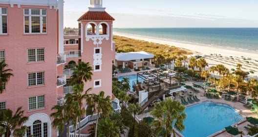Pink hotel with ourdoor pool and beach