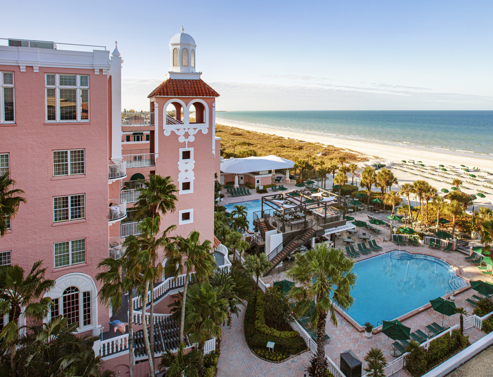 Pink hotel with ourdoor pool and beach