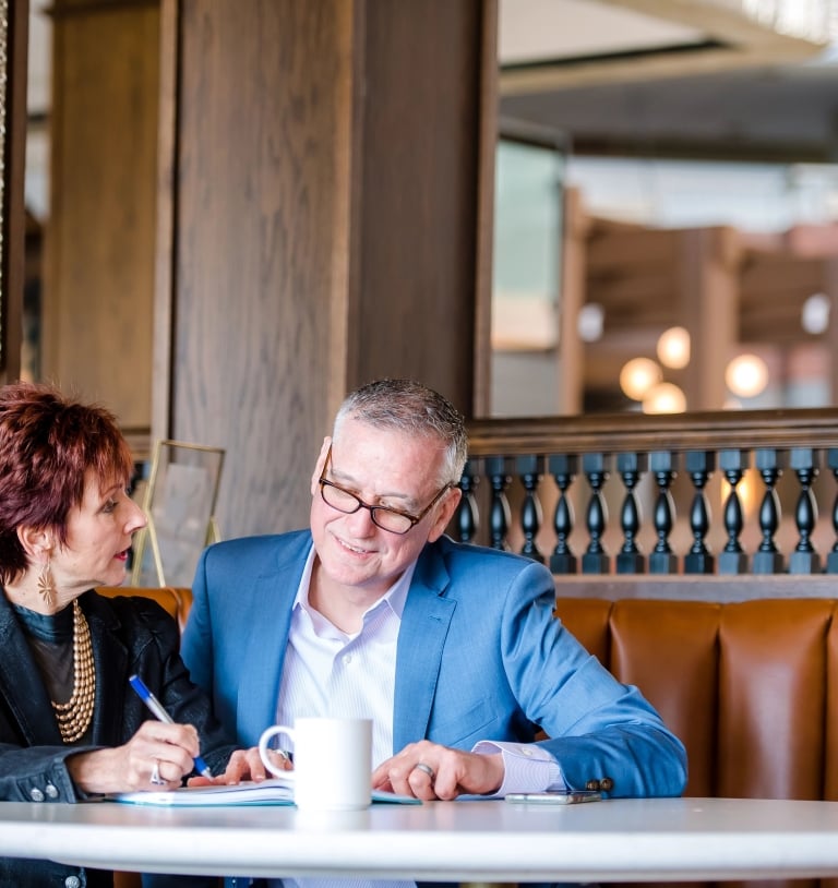 Two business professionals looking over a report