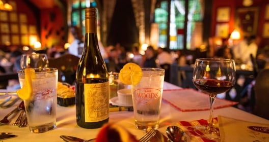 Restaurant with bottle of wine and menus