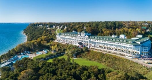 The exterior of The Grand Hotel. The ocean can be seen in the background.