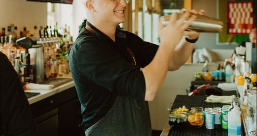 man shaking cocktail