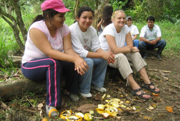 Pulling down naranjas (oranges) and Papayas from the tree with my host family