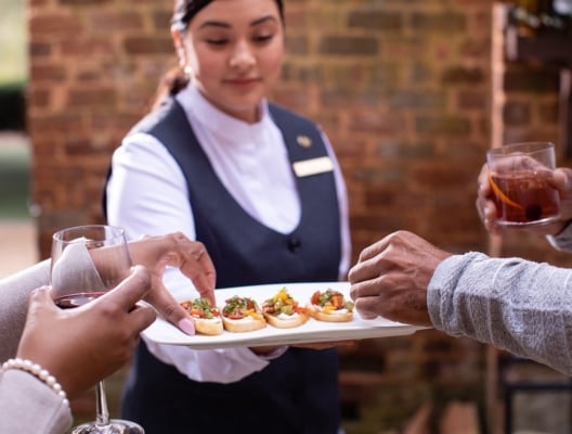 Women serving appetizers