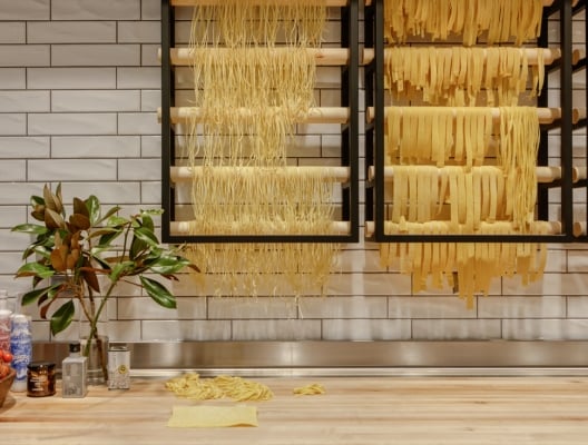 Fresh pasta drying on rack