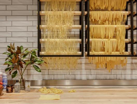 Fresh pasta drying on rack