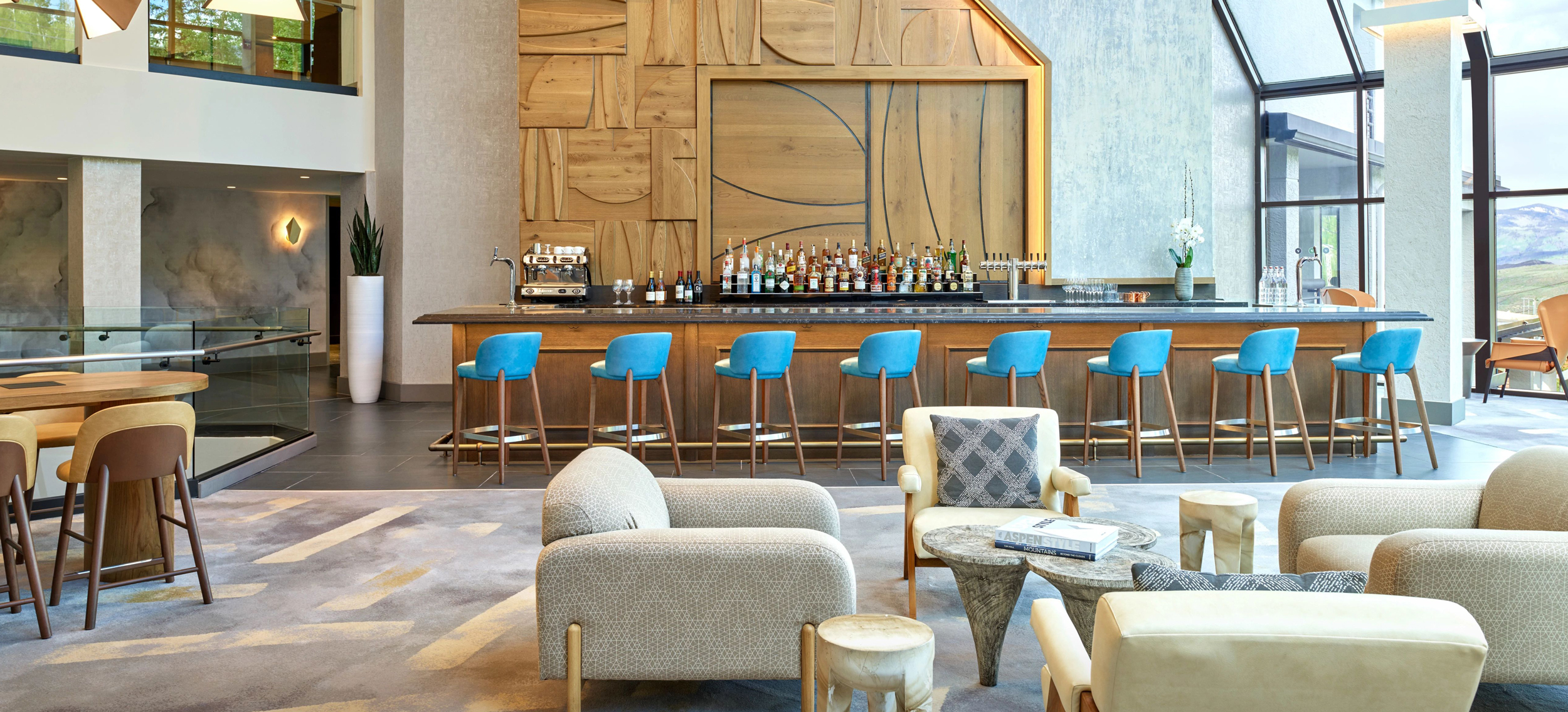 bar lounge with teal bar seats