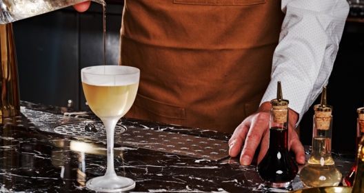 bartender pouring cocktail